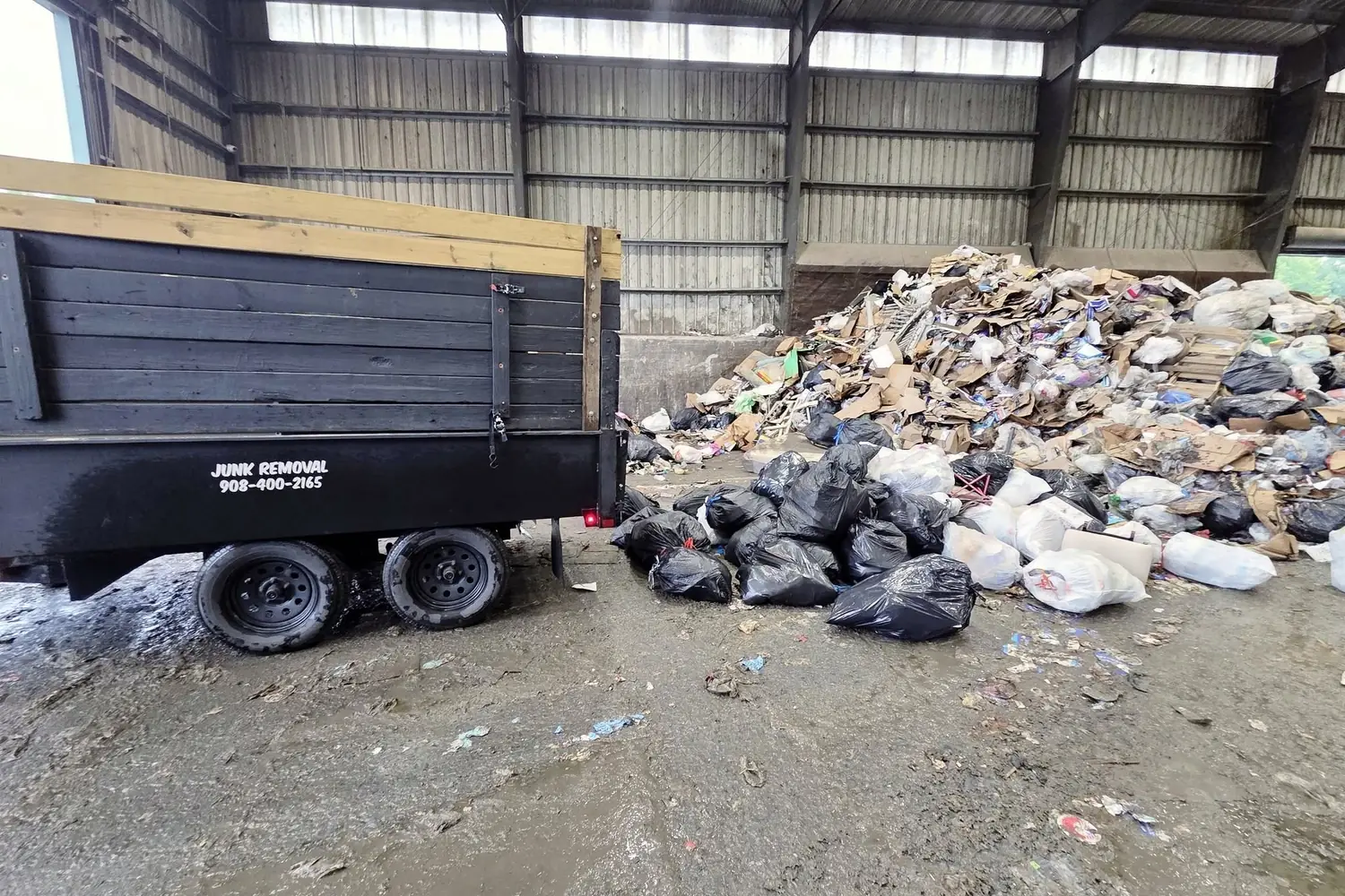 Tipping inside a permitted transfer station. This is the step the cheapest quotes leave out.